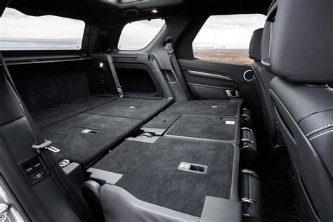 Pull the strap and lift the seat up. . Fold down rear seats range rover sport